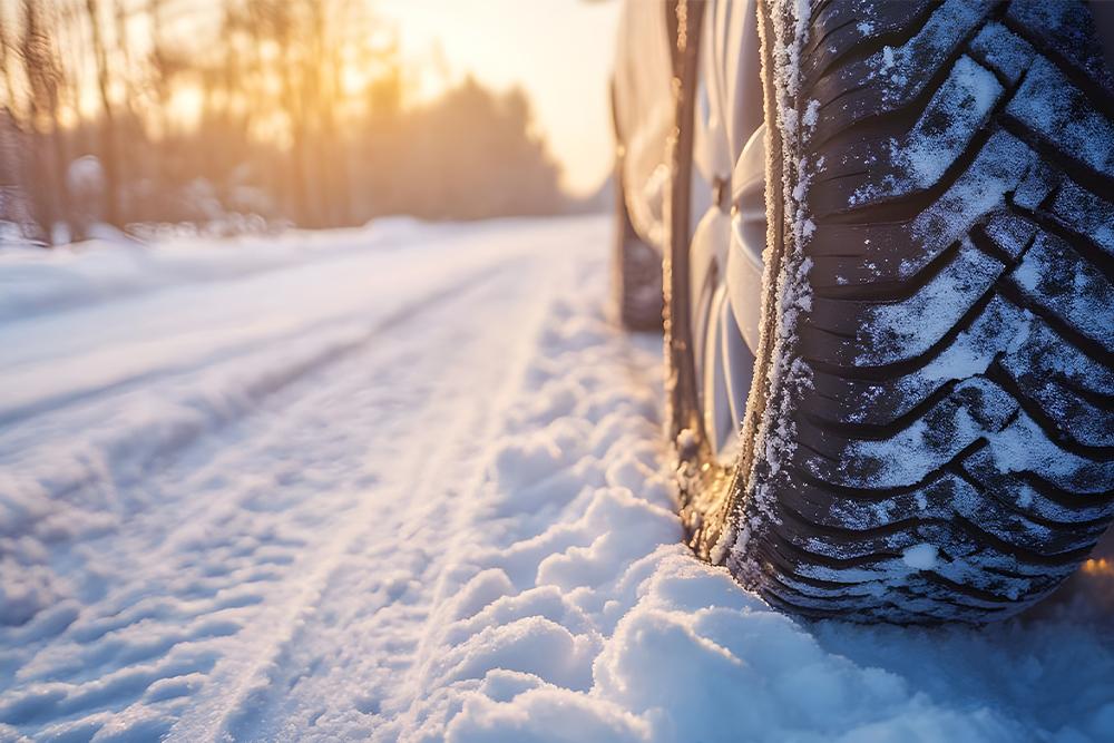 An image of a vehicle tire on snow