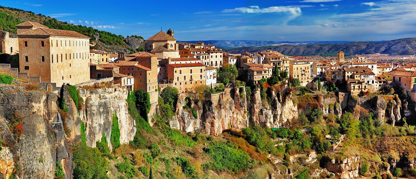 Town in Spain sitting on the ledge of a cliff